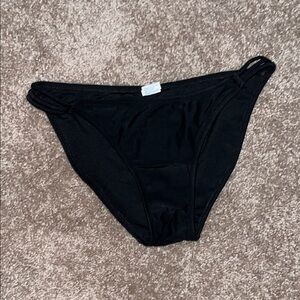black bikini bottoms with hip cutouts